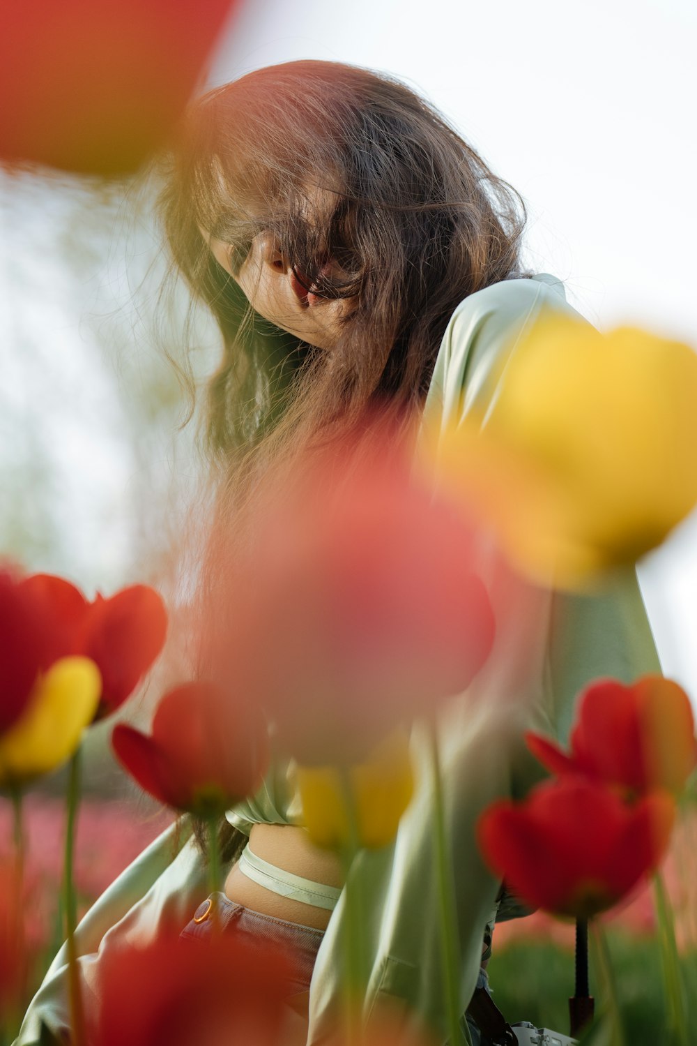 a person smelling a flower