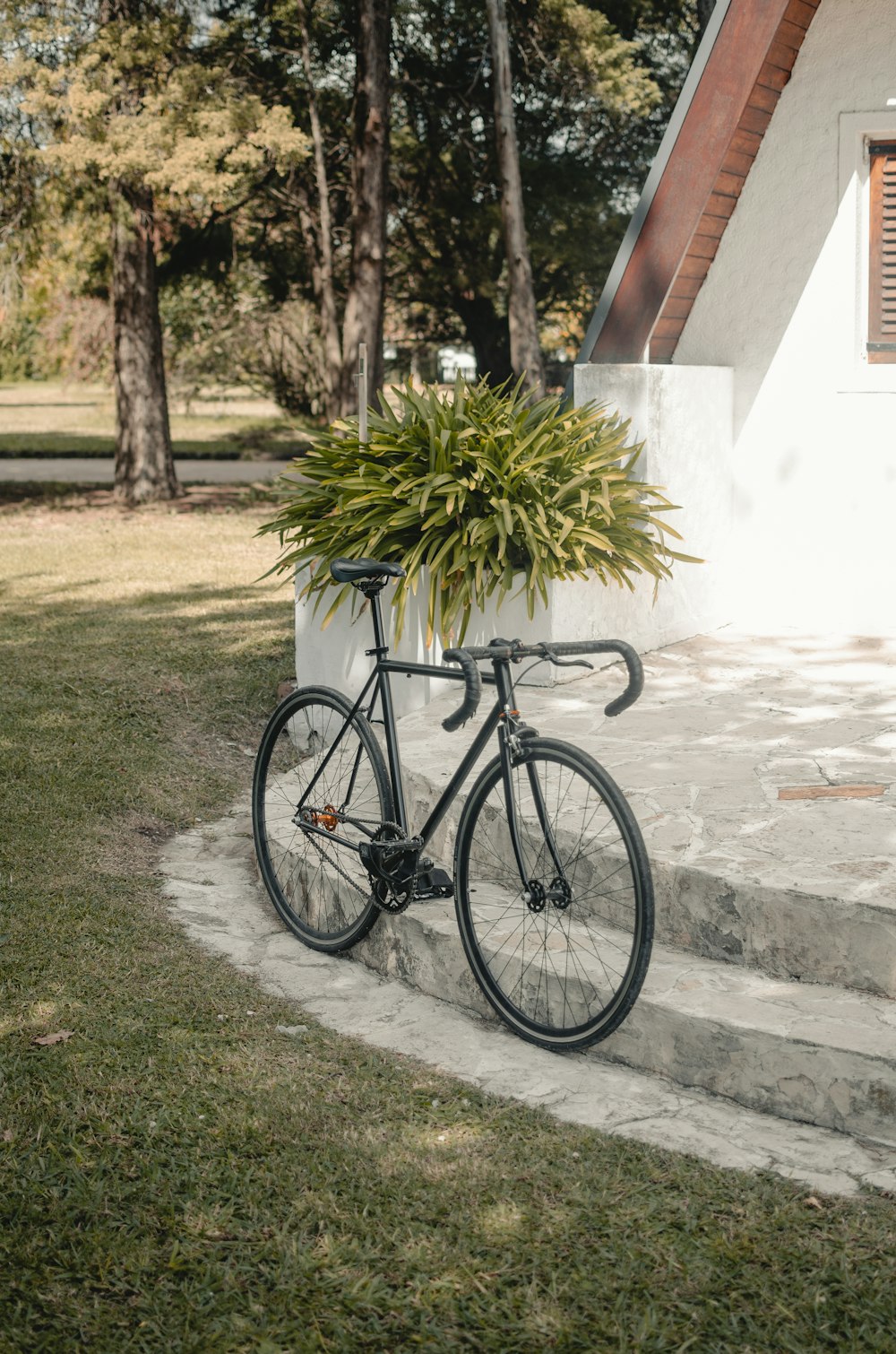 a bicycle parked on a sidewalk