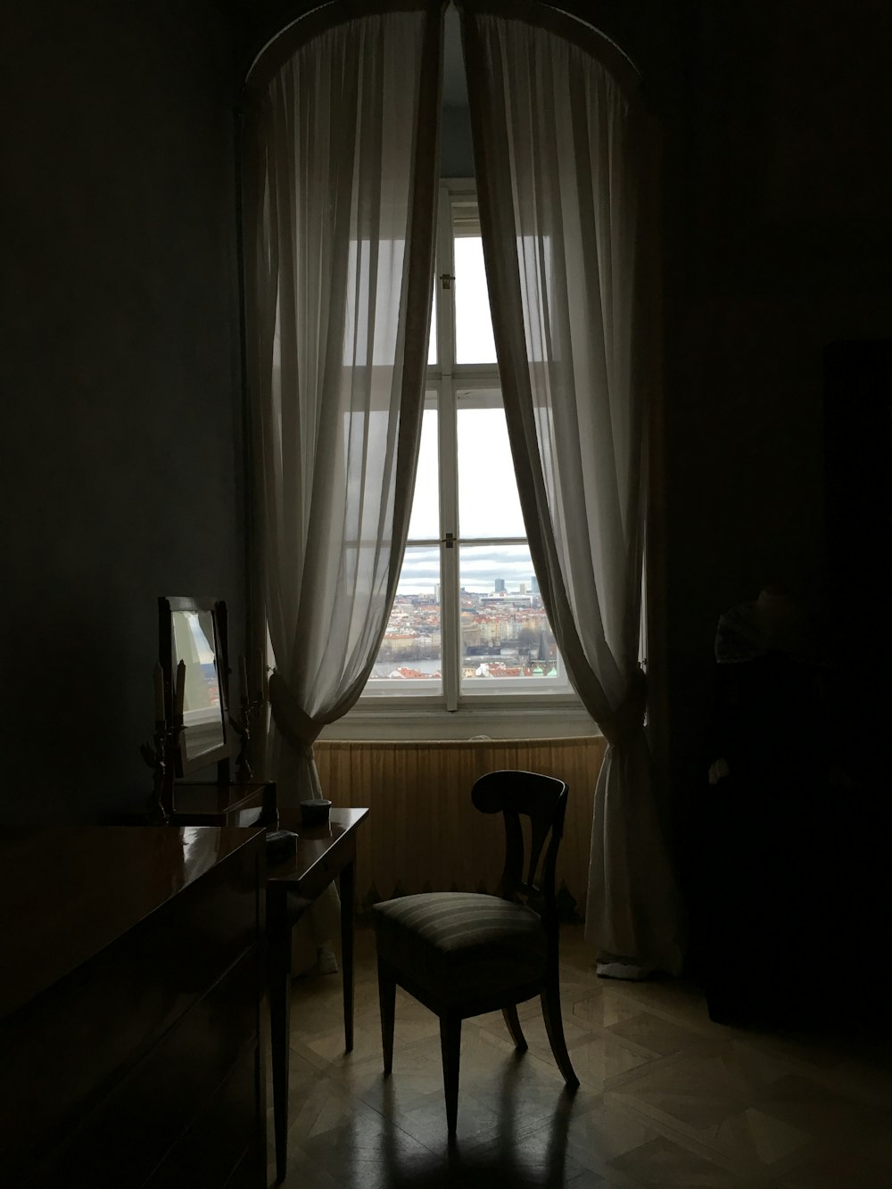 a room with a desk and a window