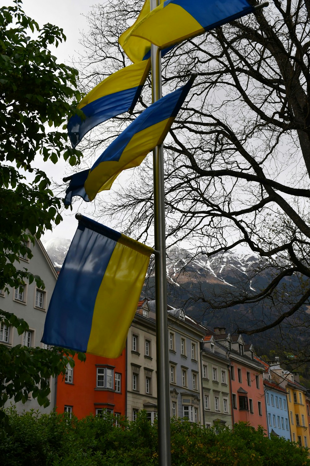 a group of flags on a pole