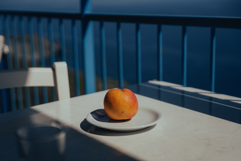 an orange on a plate