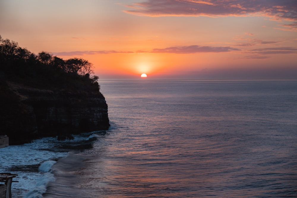 a sunset over a body of water