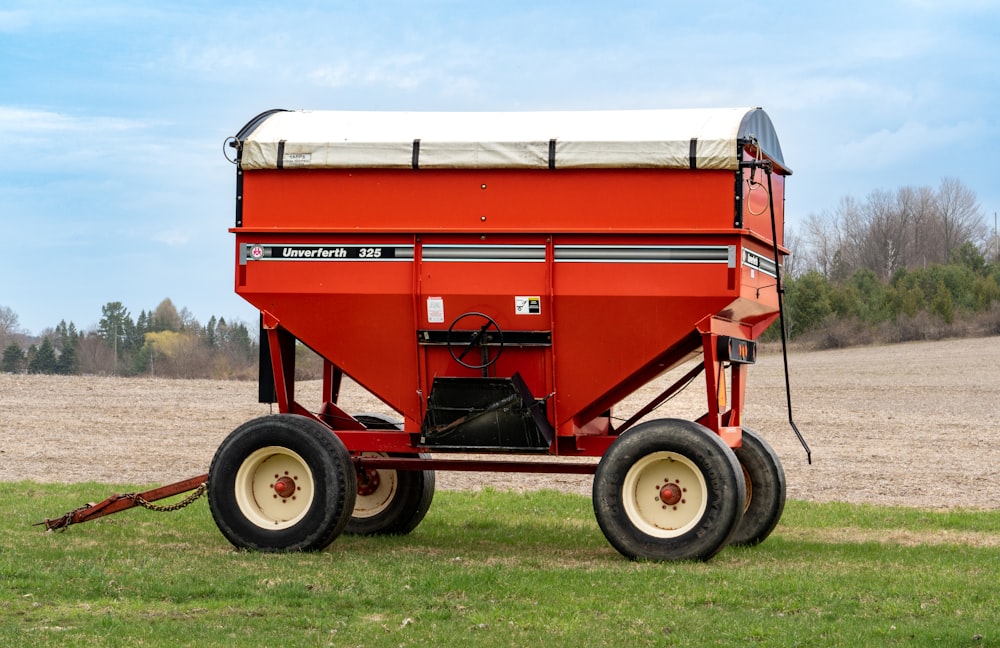 a red tractor on a field