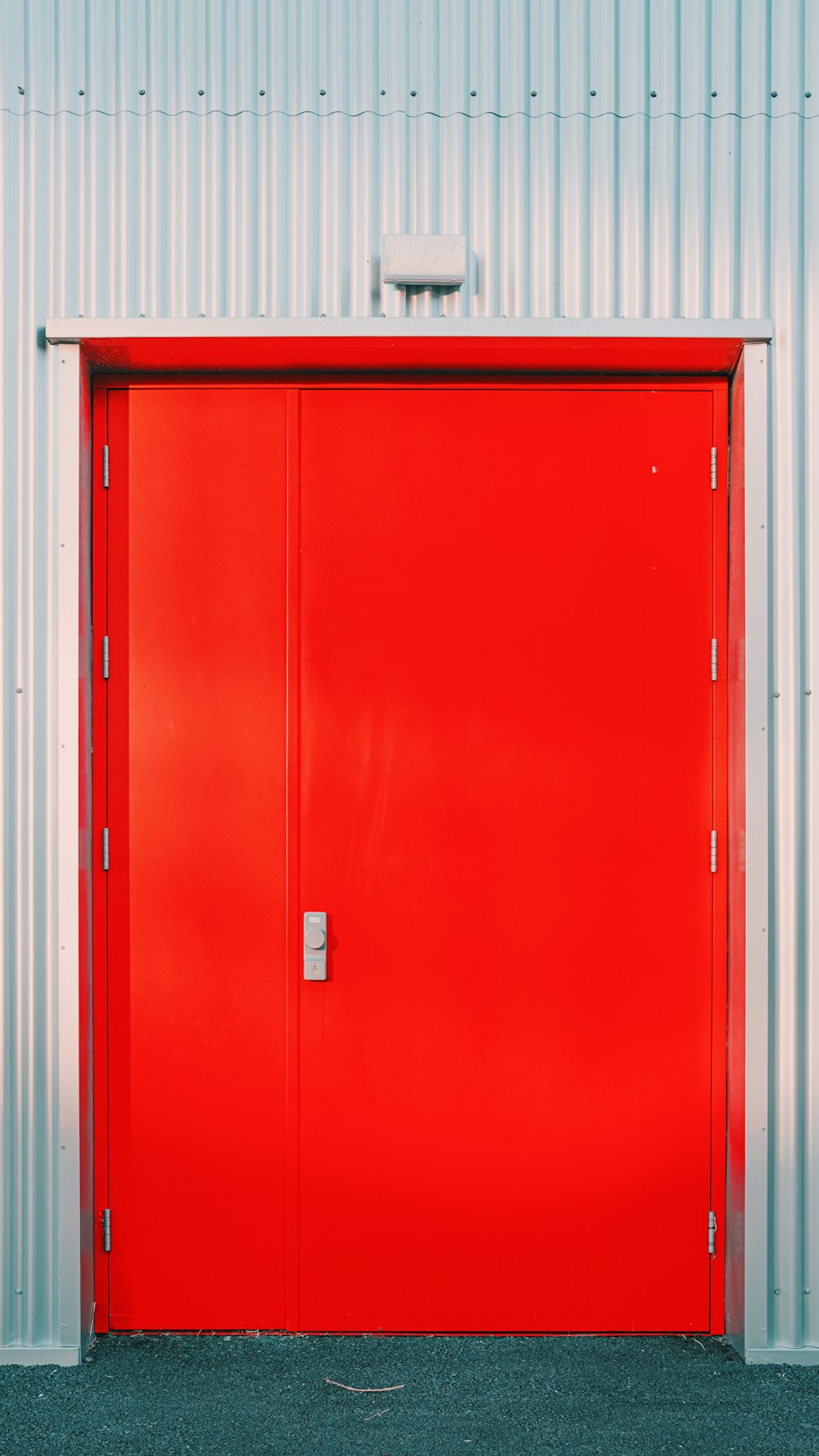 a red door with a white box on the top
