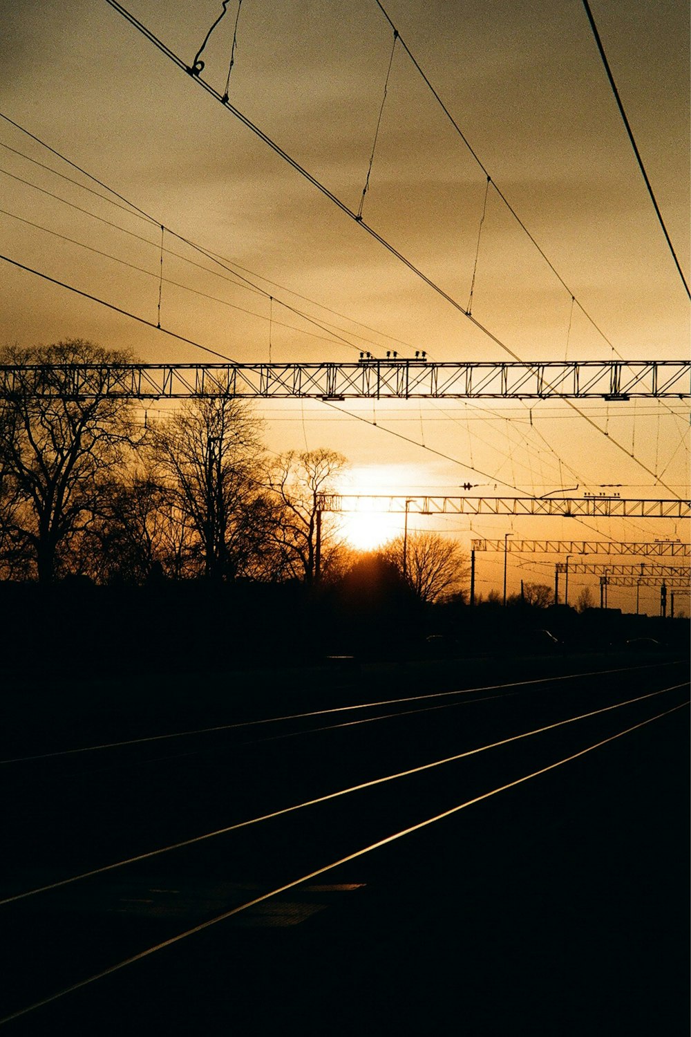 a sunset behind a power line