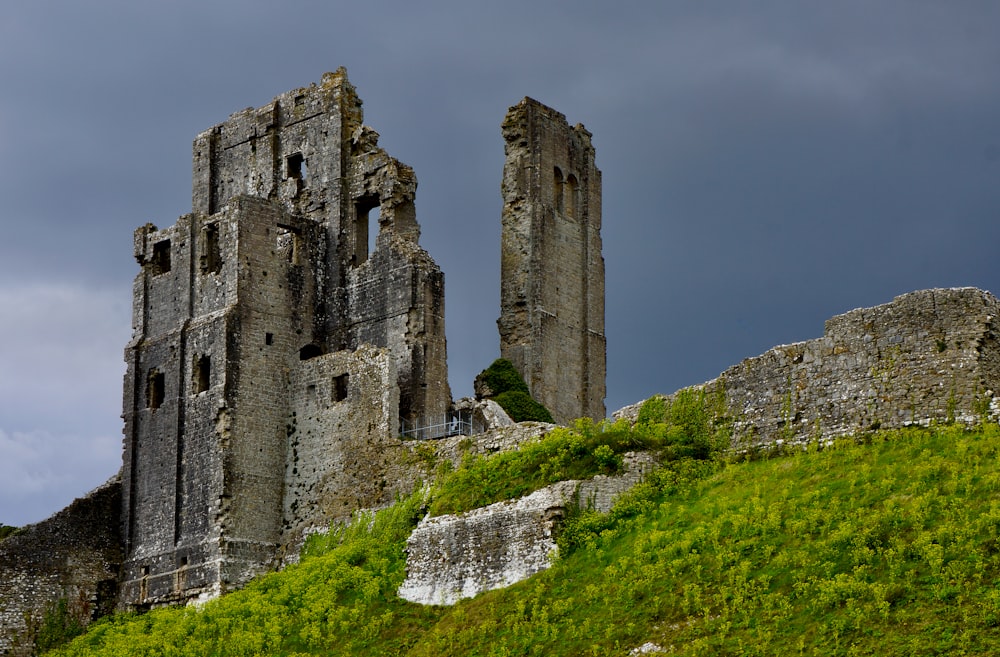 a stone castle on a hill