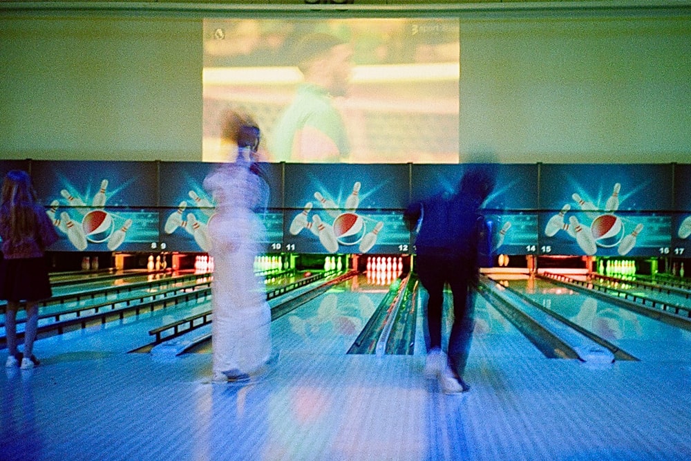 a group of people playing bowling