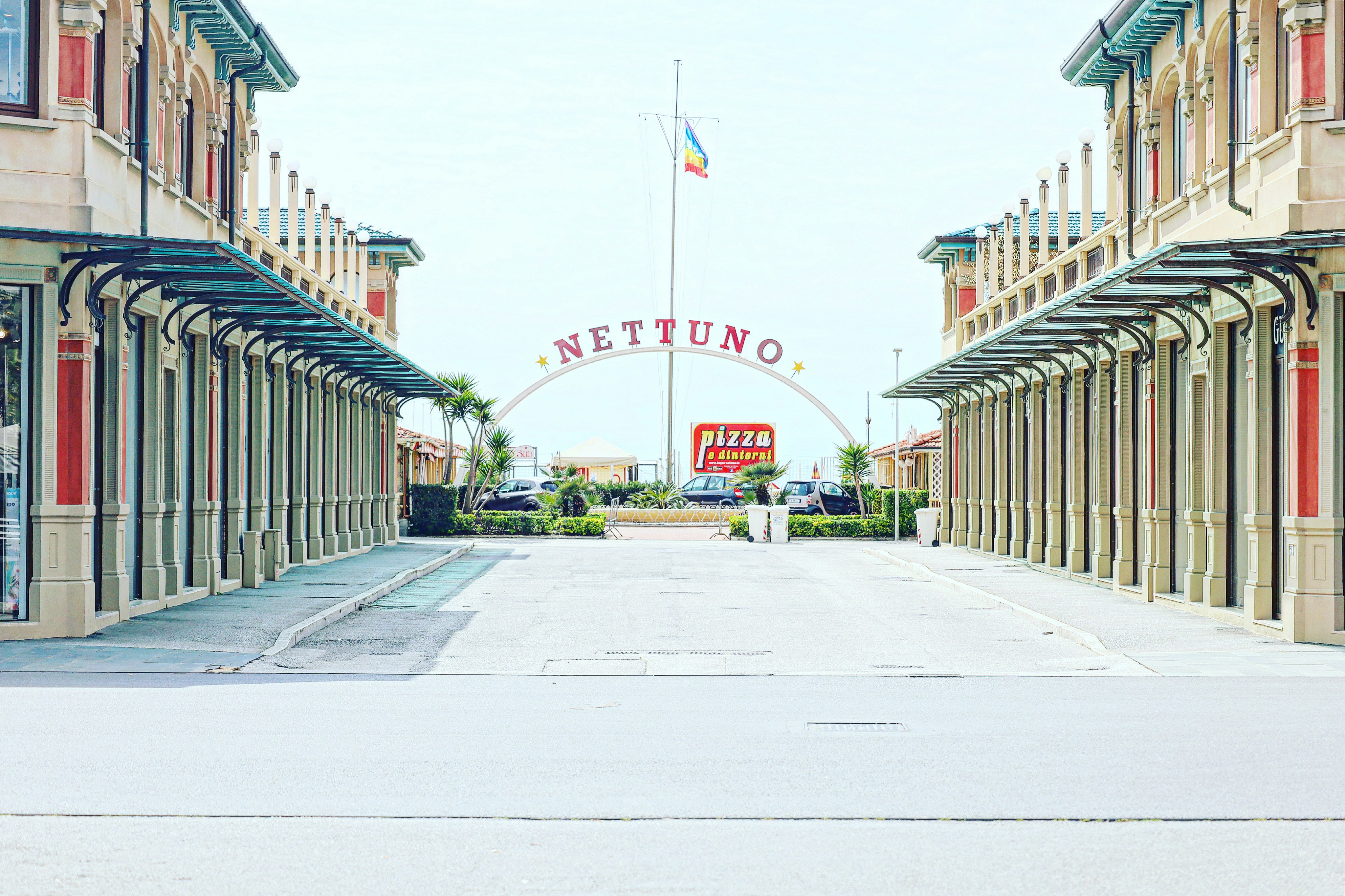 a street with buildings and a sign