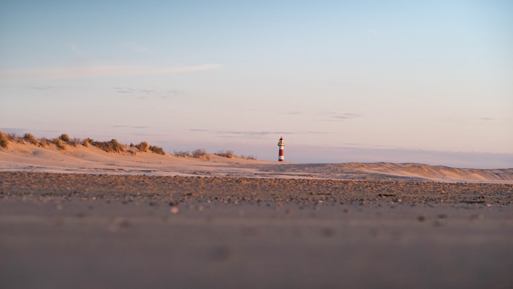 a lighthouse on a beach