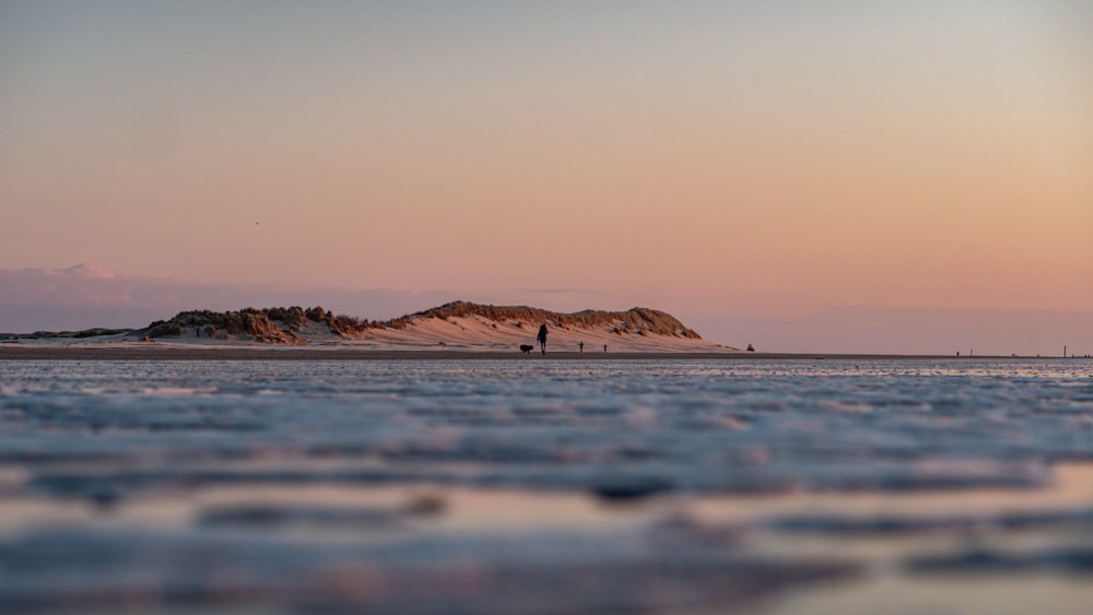 a body of water with a land in the distance