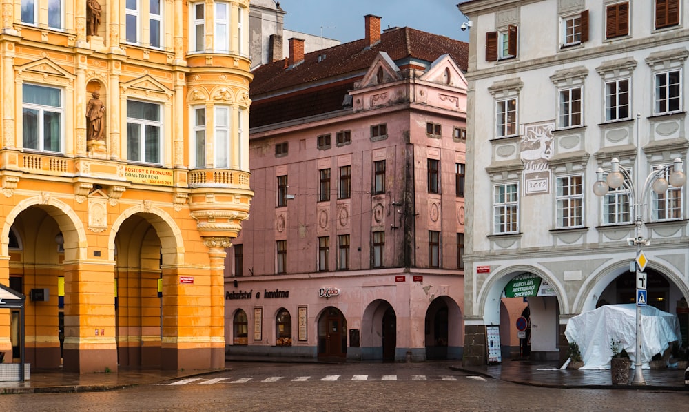 a group of buildings with a fountain in front of them