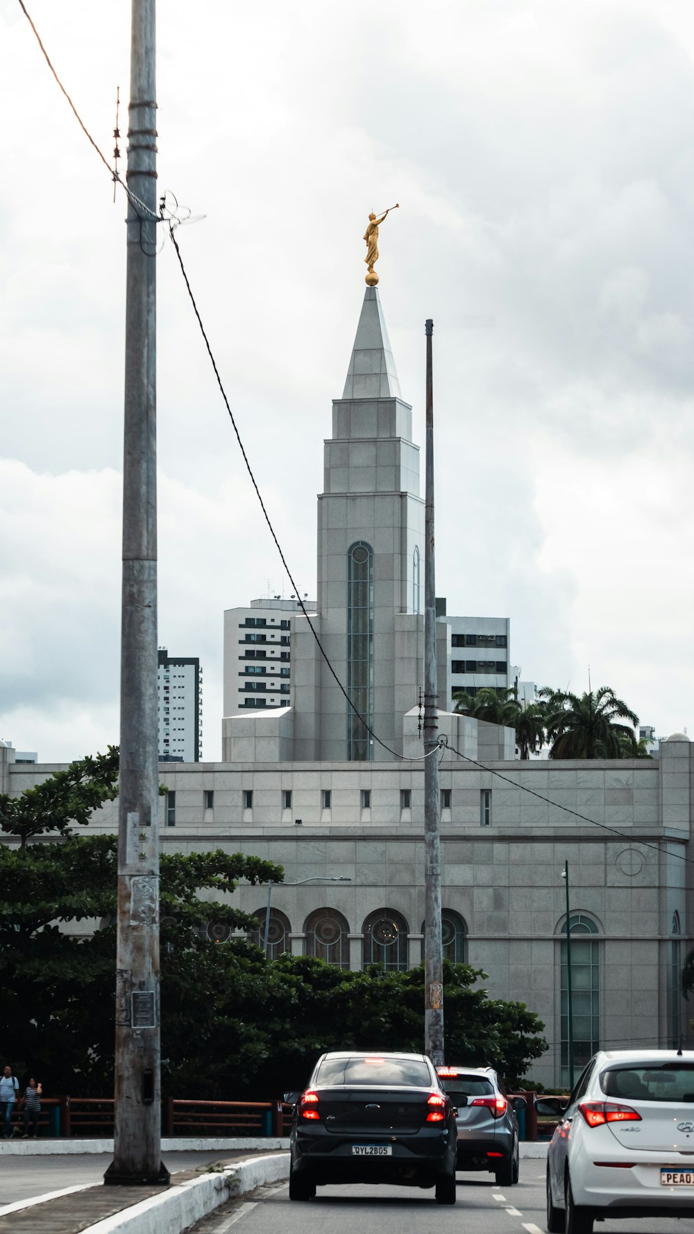 a building with a gold statue on top