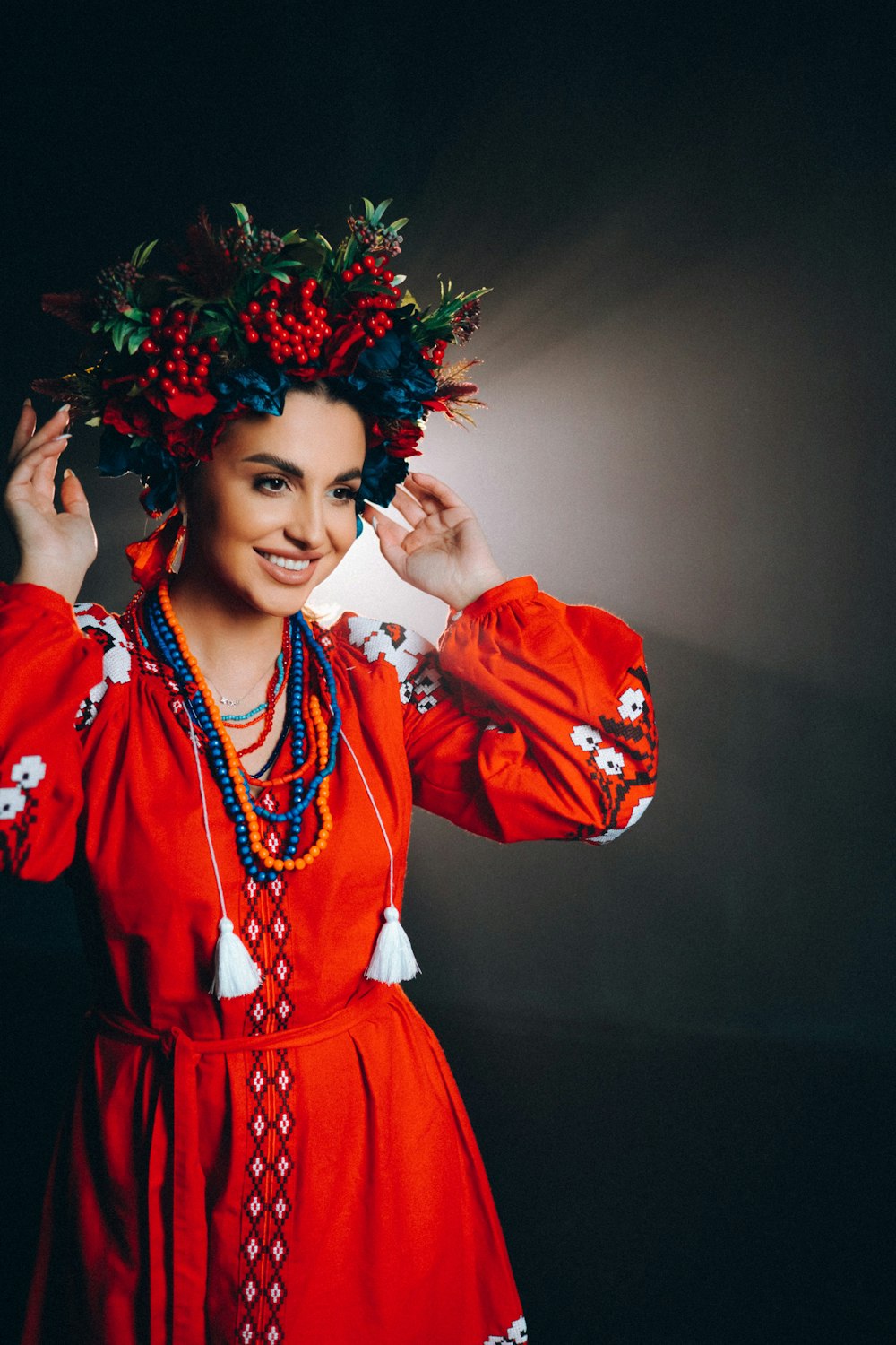 a person wearing a red dress and a crown