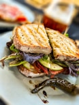 a sandwich with lettuce and tomato