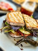 a sandwich with lettuce and tomato