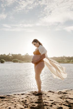 Serene pool scene with a pregnant woman practicing gentle water exercises under guidance.