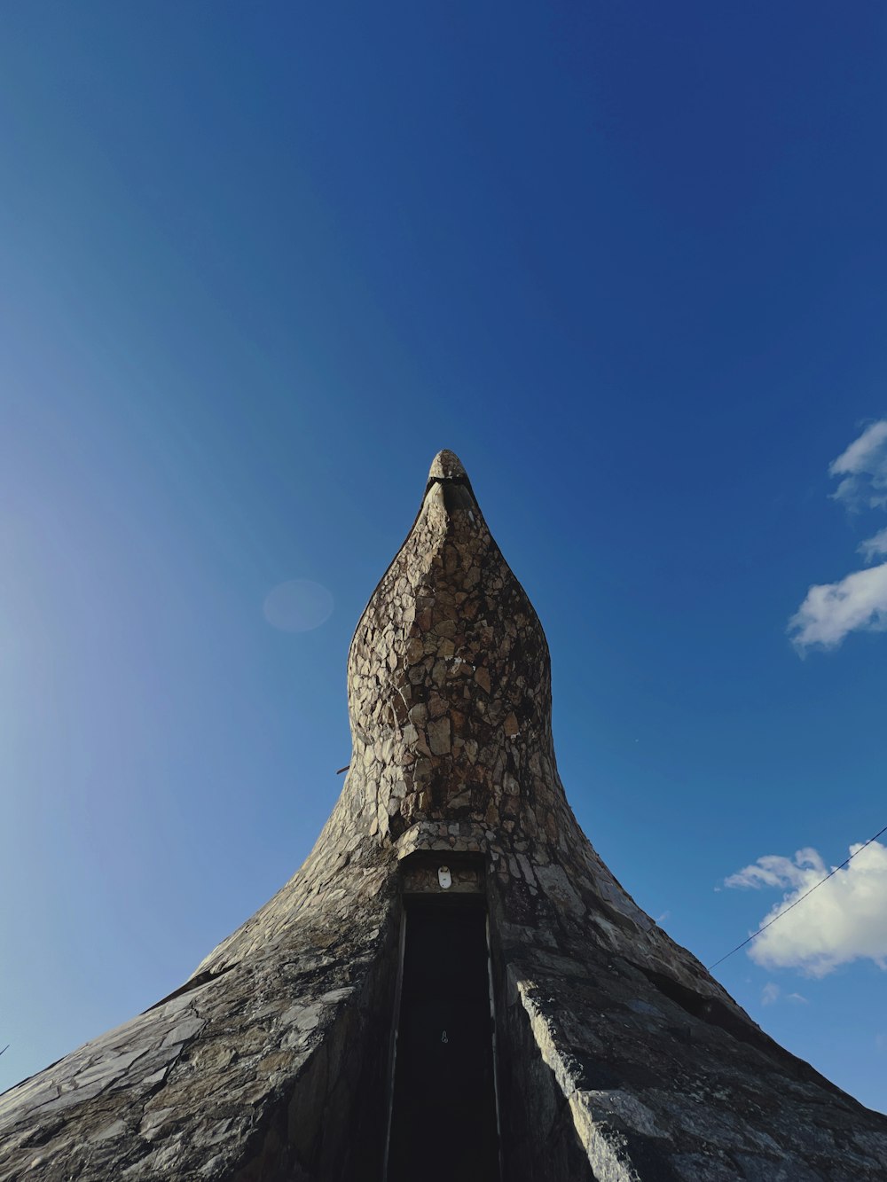 a tall pyramid with a blue sky
