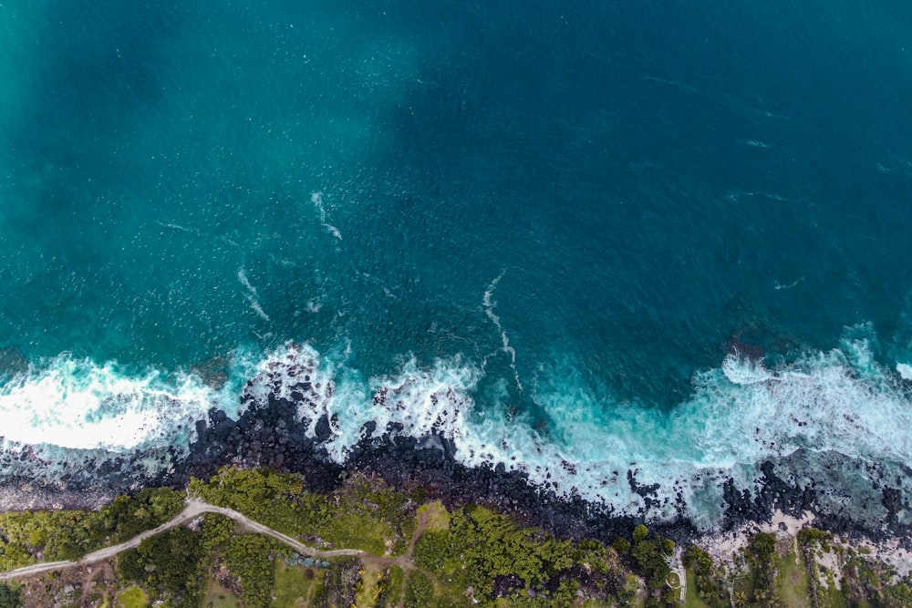 a wave crashing on a rocky shore