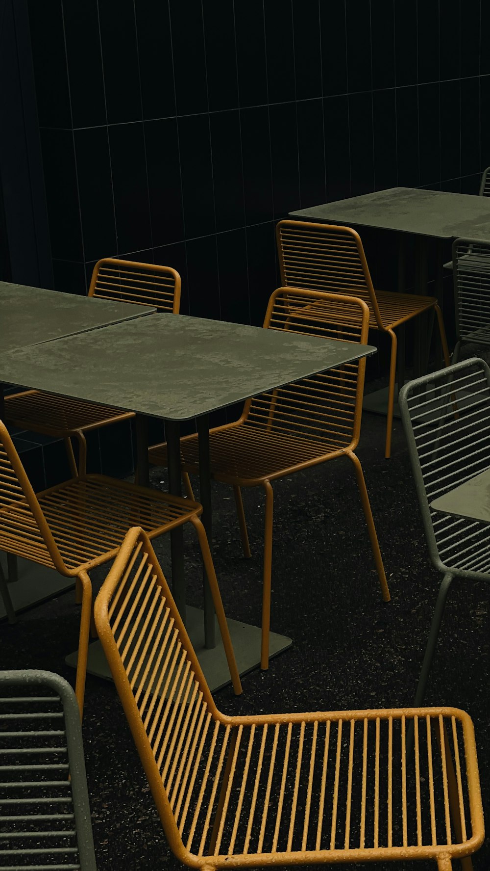 a group of tables and chairs