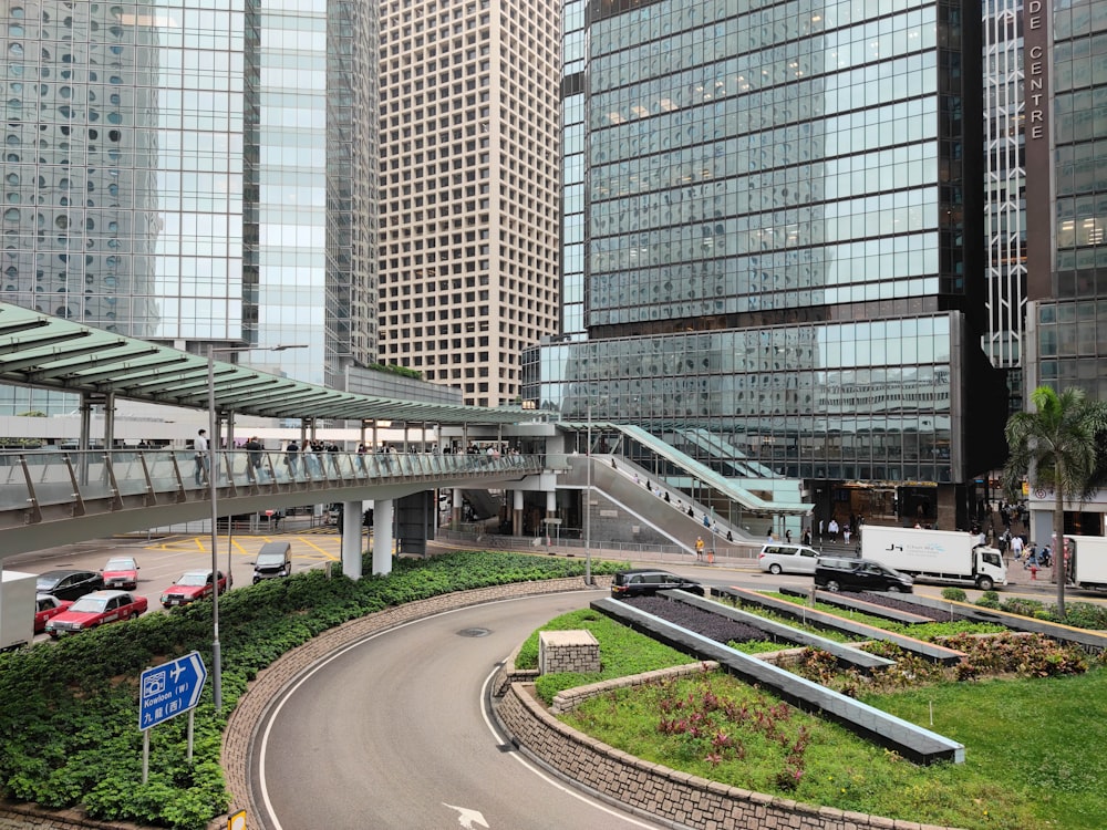 a road with cars and buildings around it