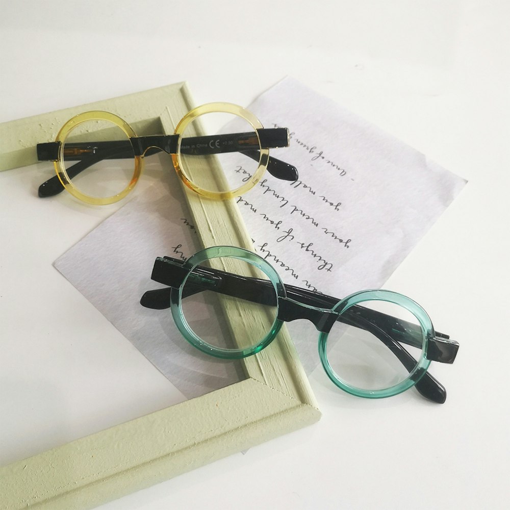 a pair of glasses on top of a book