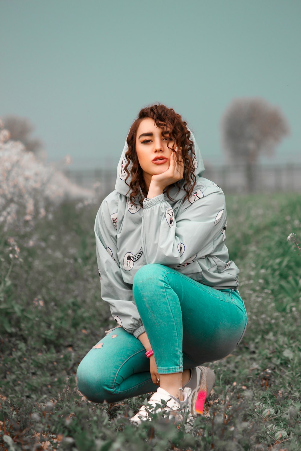 a person sitting on a rock