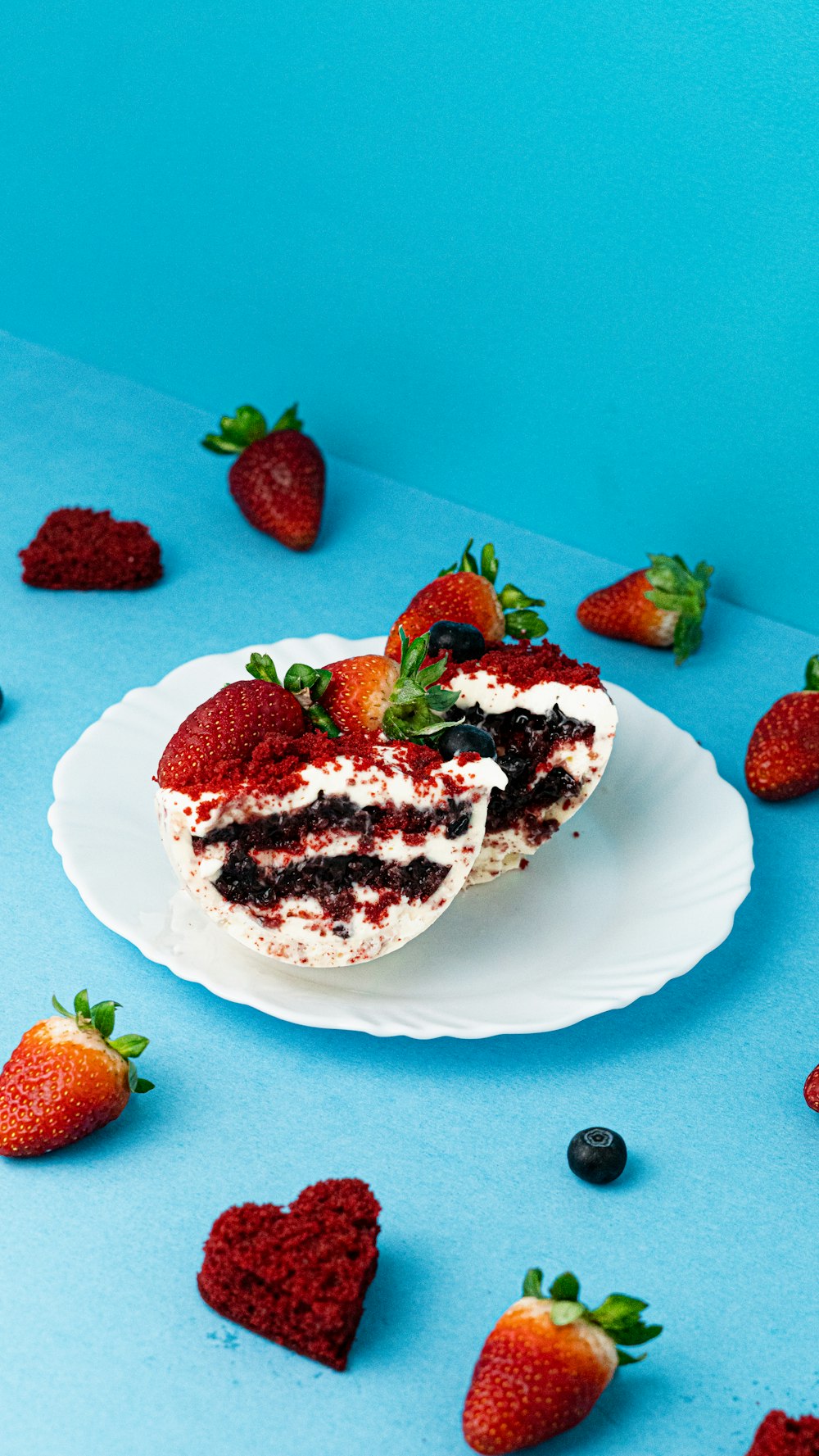 a plate of dessert with strawberries and chocolate syrup