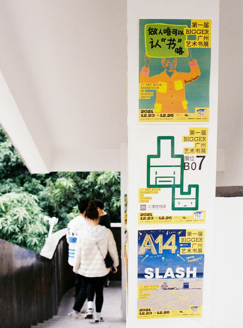 a person walking next to a sign