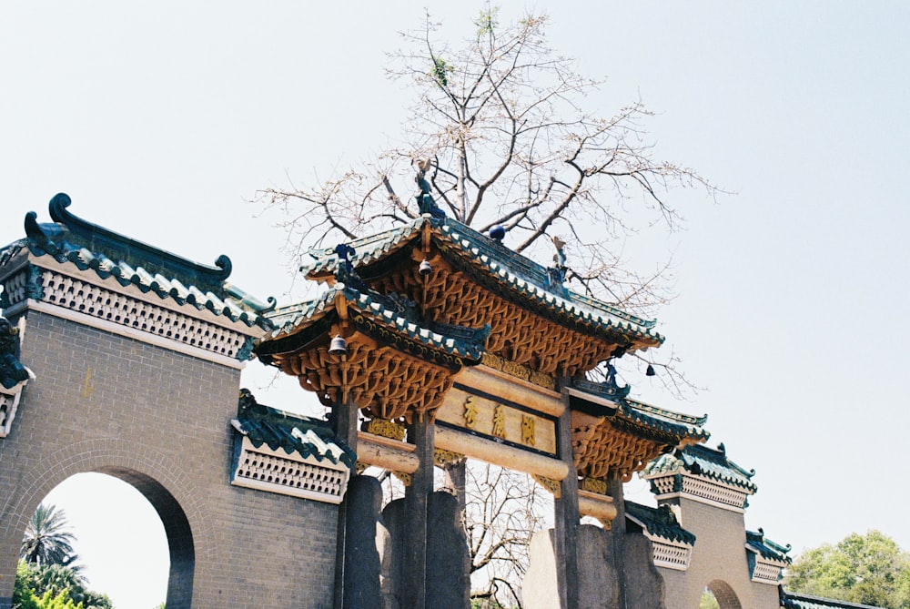 a pagoda with a tree in the front