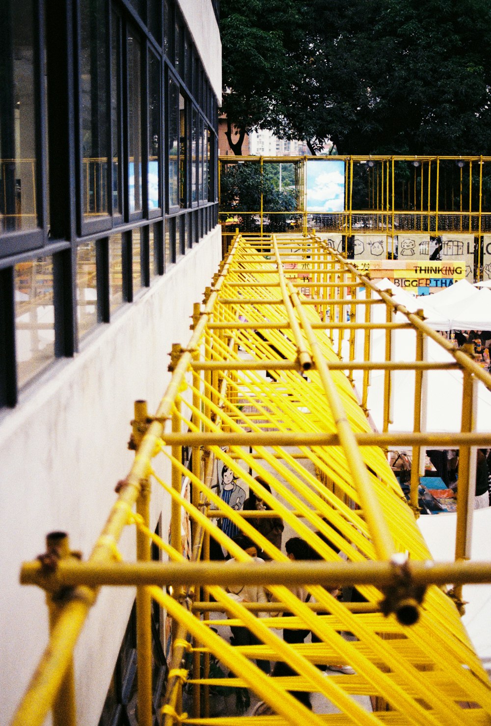 a yellow metal railing