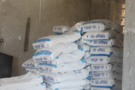 Warehouse stacked with neatly arranged bags of high-quality coke.