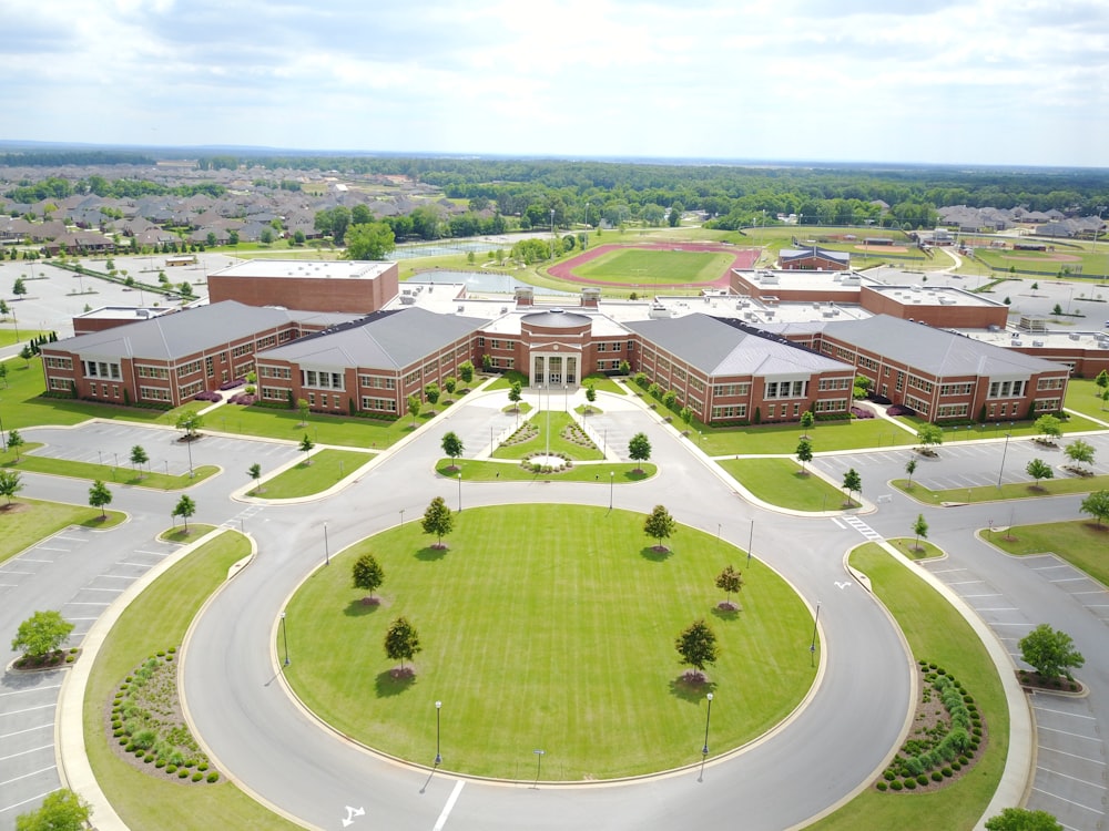 a large building with a green lawn