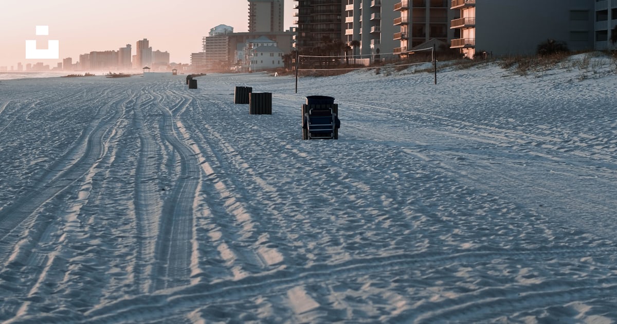 A snowy road with buildings on either side of it photo – Free Panama