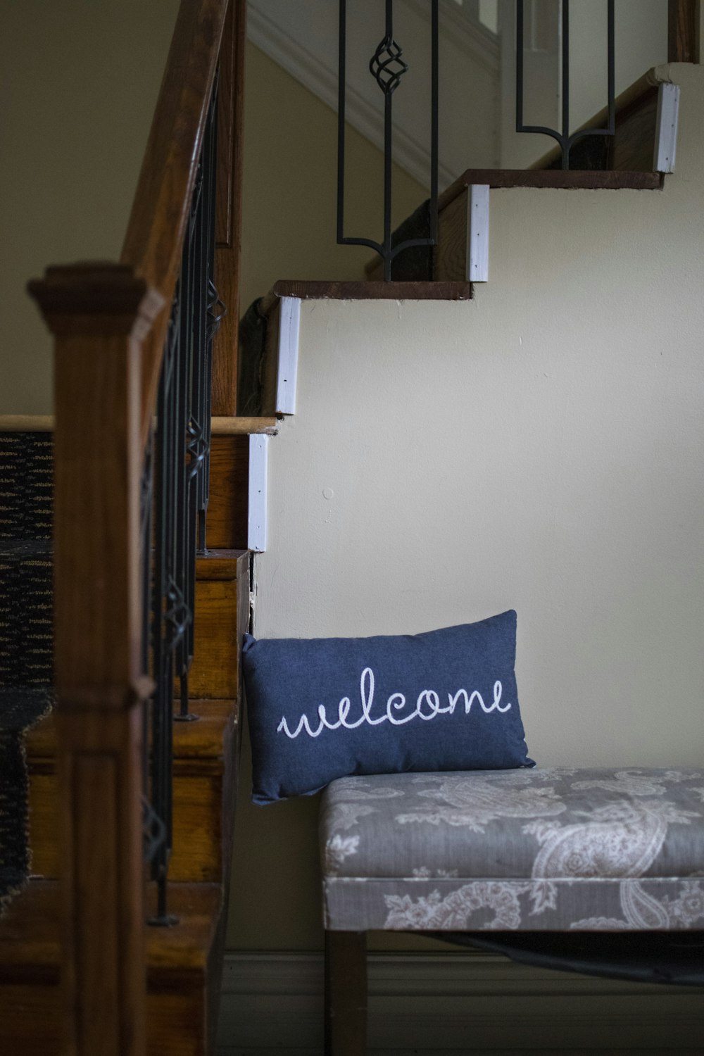 a bed with a blue pillow