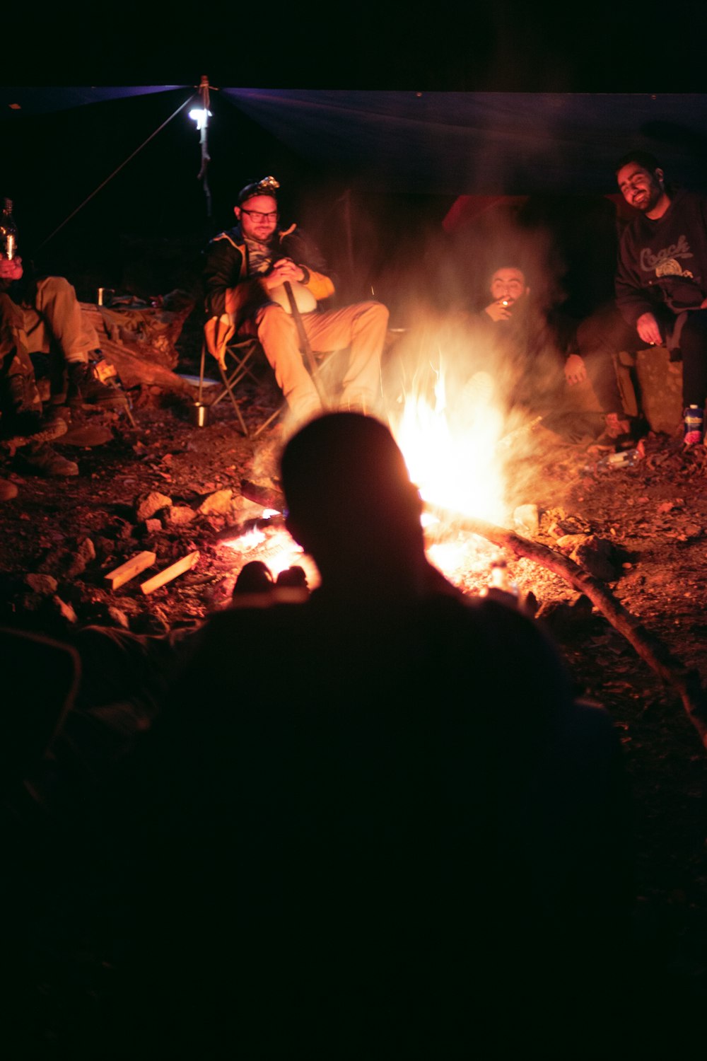 a group of people around a fire