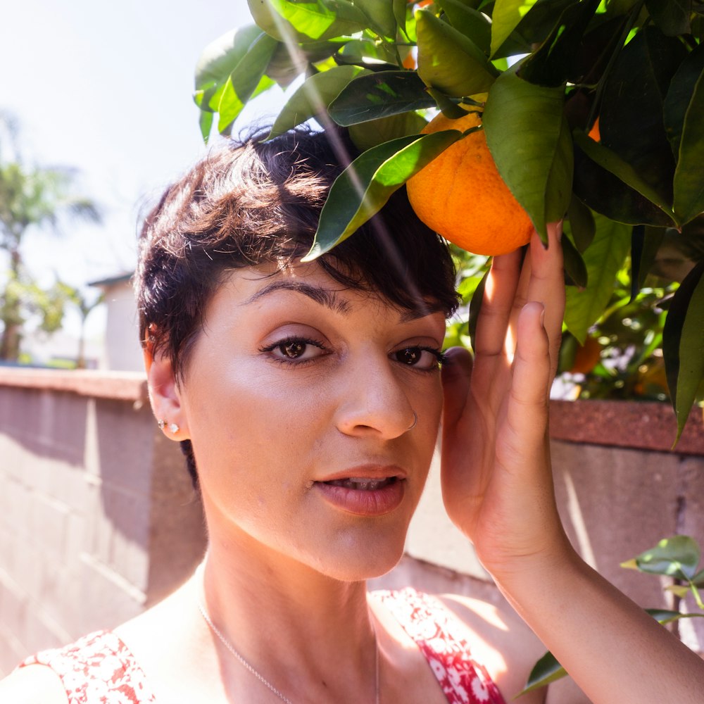 a person holding a fruit