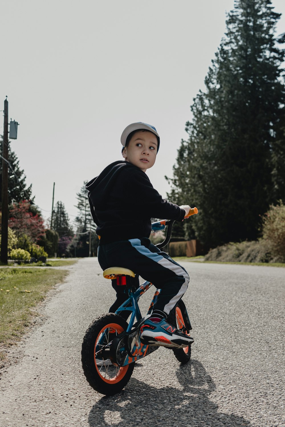 a boy riding a bicycle