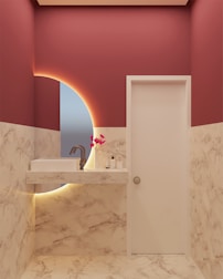 Elegant marble sink showcased in a stylish office restroom.