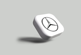 a white square with a black circle