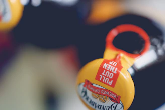 Close-up of hands opening the Tizerpacaps bottle, highlighting the premium packaging details.