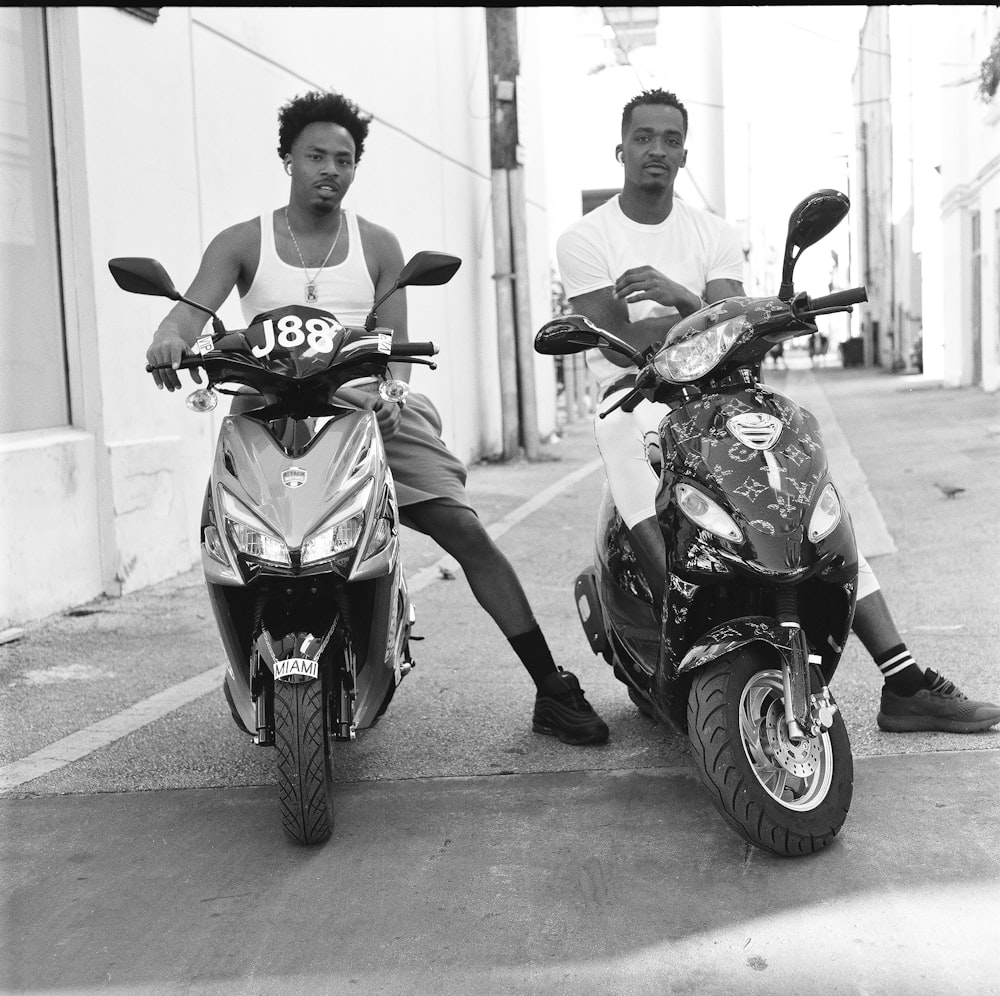 a couple of men on motorcycles