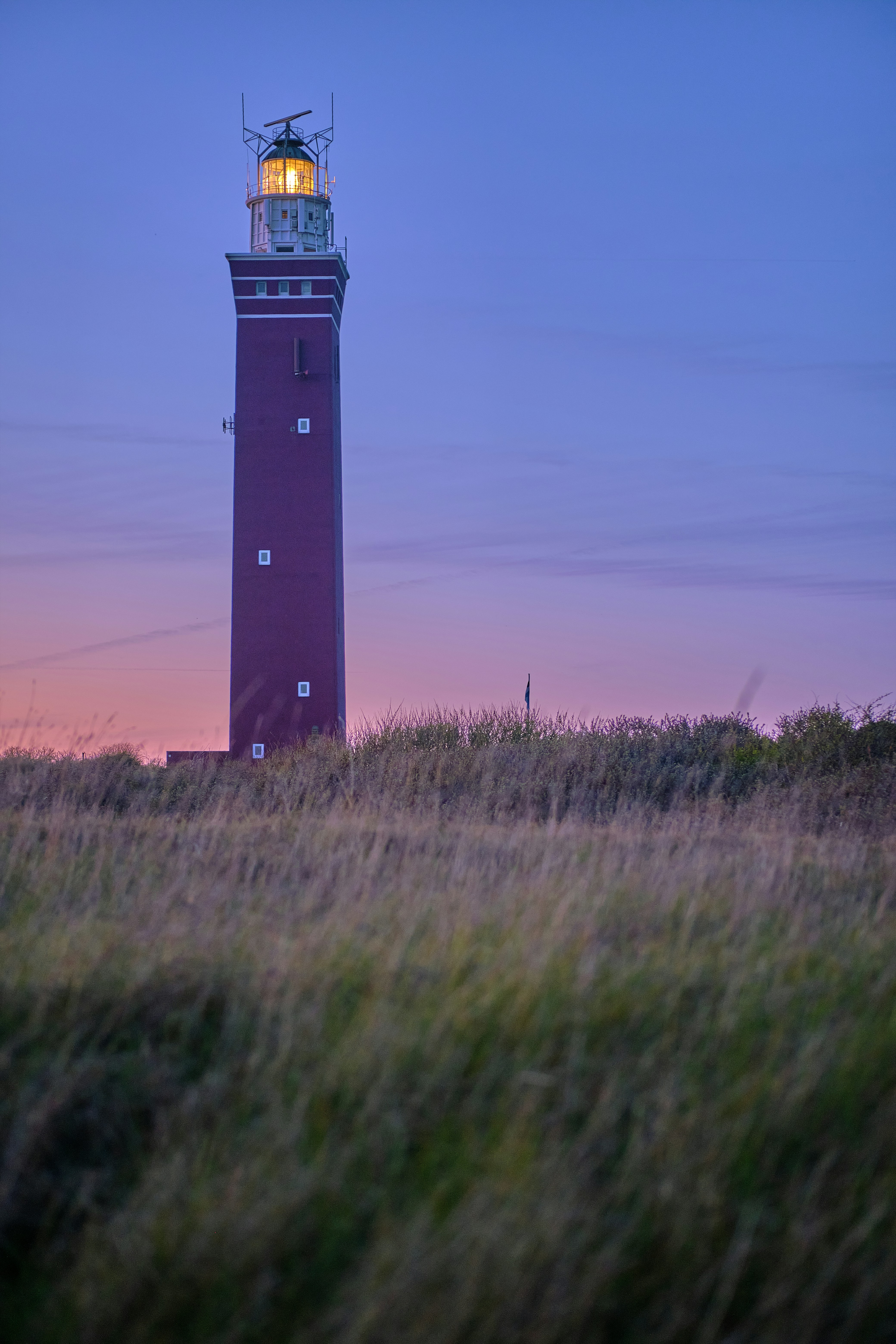 a lighthouse in a field