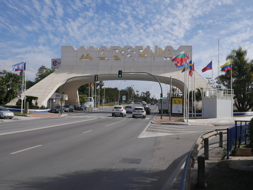 a street with cars and flags