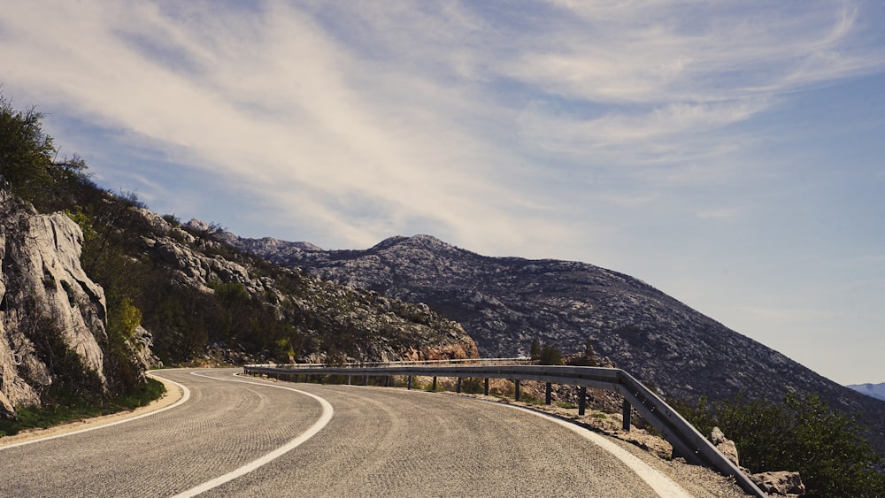 a road with mountains on the side