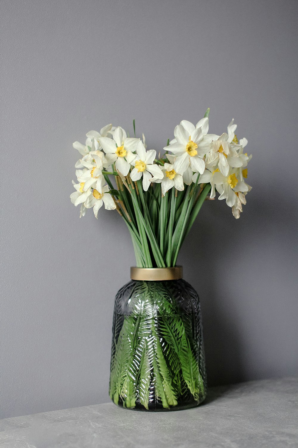 a vase with white flowers