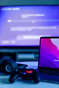 a video game controller and a laptop