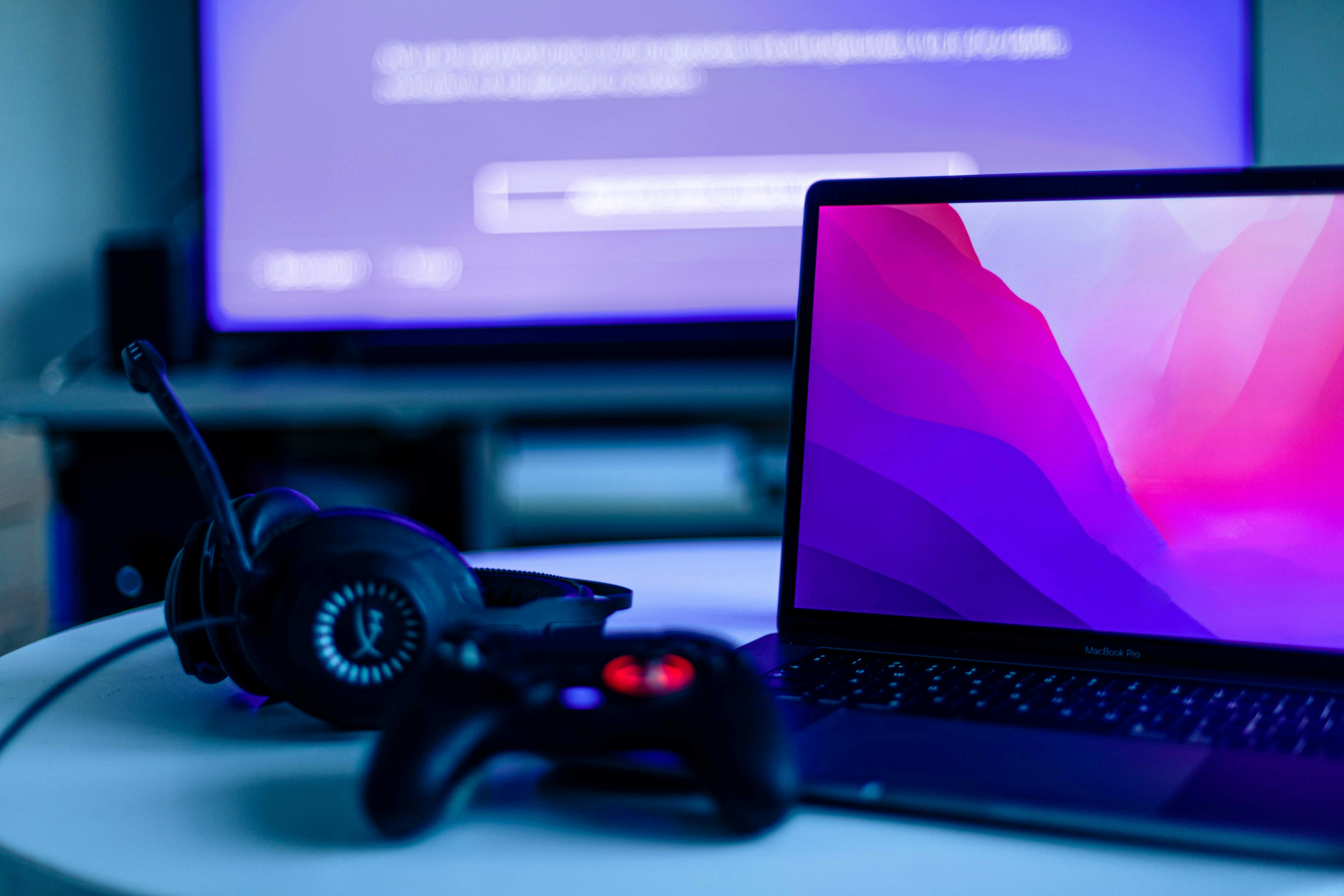 a video game controller and a laptop