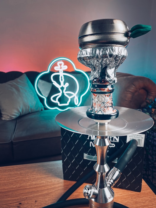 A cozy lounge area with people enjoying hookah in a relaxed atmosphere.
