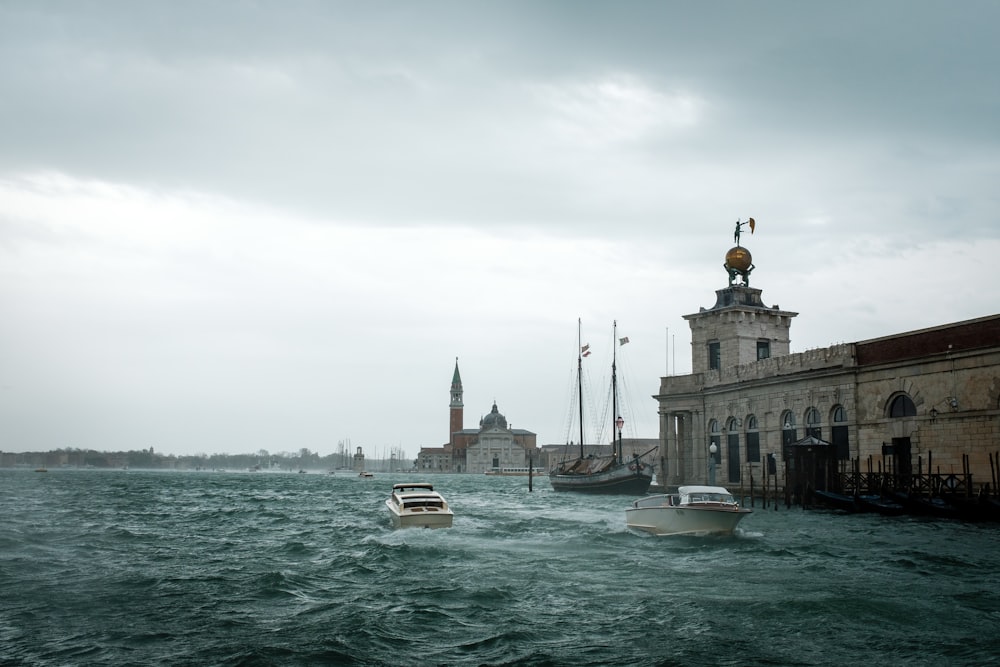 a body of water with boats in it and buildings around it