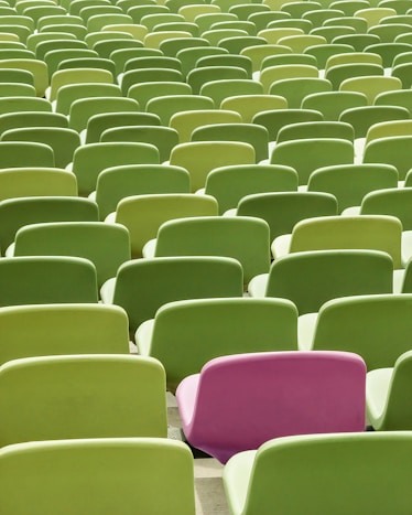 a large group of green chairs
